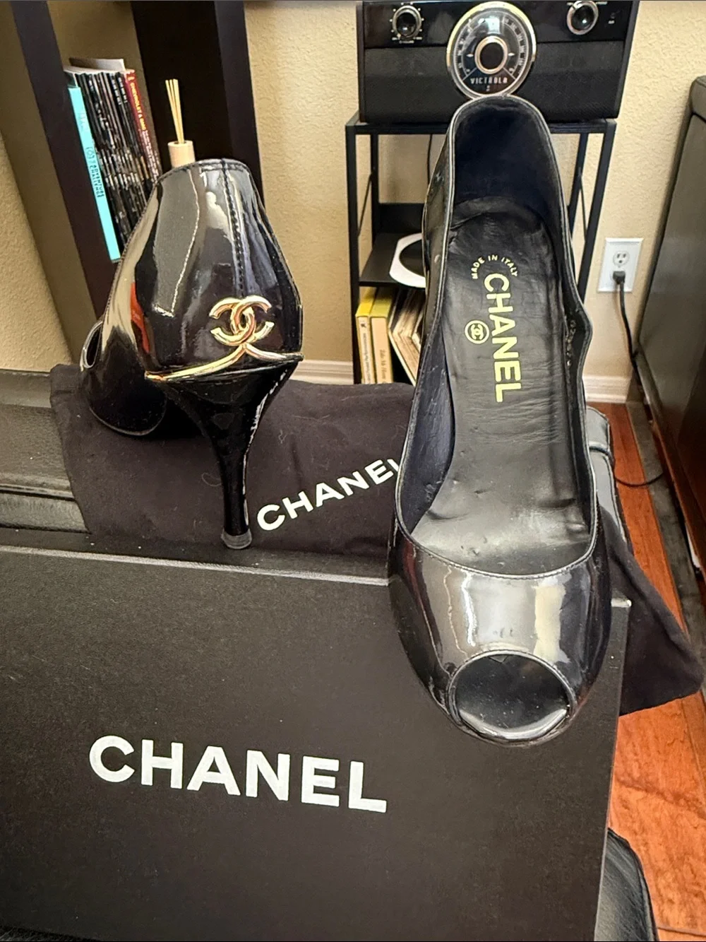 CHANEL Black Patent Peep-Toe Stiletto Pumps with Gold CC Heel Accent